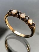 9ct Gold ladies ring set with small Opals and Garnets size R