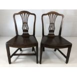 Pair of Oak hall chairs with pierced back decoration