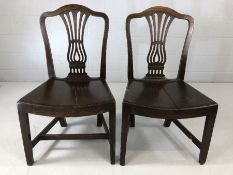 Pair of Oak hall chairs with pierced back decoration