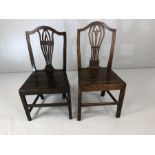 Pair of similar Oak hall chairs with pierced back decoration