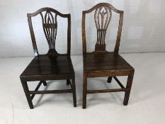 Pair of similar Oak hall chairs with pierced back decoration