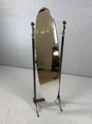 Brass-framed oval cheval mirror with cherub detailing