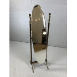 Brass-framed oval cheval mirror with cherub detailing