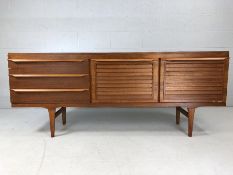 Mid Century sideboard by Elliotts of Newbury with two cupboards and three drawers. Approx length