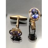 14k yellow Gold Cuff links each set with an approx 8.5mm x 6.5mm Oval Tanzanite, with a 'Gemporia