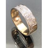 9ct yellow Gold Ring with a Diamond Greek Key pattern set into an approx 6.6mm band. Sixe approx V.5