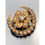 Small Victorian Gold (unmarked) Seed Pearl and Diamond Crescent Brooch measuring approx: 19.5mm