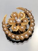 Small Victorian Gold (unmarked) Seed Pearl and Diamond Crescent Brooch measuring approx: 19.5mm