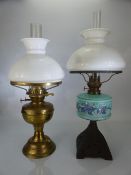 Two Victorian oil lamps with glass shades