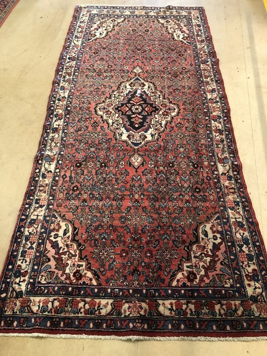 Red ground rug approx 300cm x 133cm