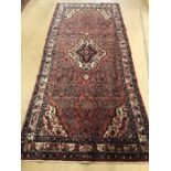 Red ground rug approx 300cm x 133cm