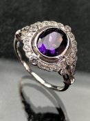 Silver and CZ ring with large central amethyst