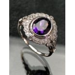 Silver and CZ ring with large central amethyst