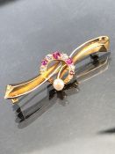 Diamond Ruby and Pearl brooch set on high carat (unmarked) Gold (total weight approx 4g)