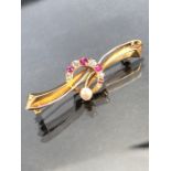 Diamond Ruby and Pearl brooch set on high carat (unmarked) Gold (total weight approx 4g)
