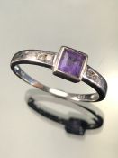 9ct White Gold Ring with a 5.2mm (including setting) square set Amyethyst and two Diamonds to each