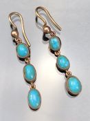 Pair Yellow Gold (Unmarked) drop earrings approx: 30.5mm drop of 3 oval Turquoise stones from