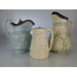 Three German stoneware jugs with relief design and pewter lids (A/F)