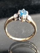 9ct yellow Gold ring set with approx 5.75mm x 4.15mm Marquess cut Blue Topaz with Diamonds to