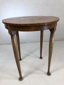 Circular occasional table with bookmatched veneer on Queen Anne legs. Diameter approx 60cm
