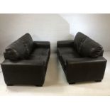 Pair of two seater black leather sofas