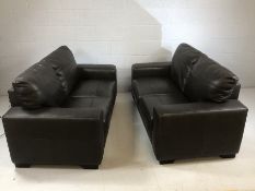 Pair of two seater black leather sofas