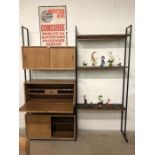 Mid-century modular teak shelving and writing desk system on three metal supports - One bureau,