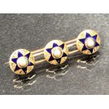 High carat gold Brooch set with three studs decorated with Diamonds Pearls and blue enamel stars (