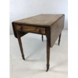 Antique pembroke table on original castors