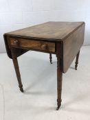 Antique pembroke table on original castors