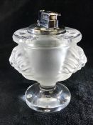 Lalique frosted glass Lion table lighter, the bulbous body decorated either side with a lions head