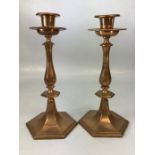 Pair of heavy Copper candlesticks on hexagonal bases approx 27cm tall
