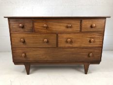 Mid century teak chest of drawers by Maple & Co with six drawers