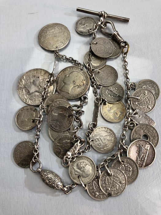 Hallmarked silver chain and Albert with a collection of various silver coloured coins total weight - Image 4 of 4