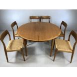 A set of six 20th century Danish teak dining chairs by Niels Moller, with woven seats and makers