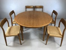 A set of six 20th century Danish teak dining chairs by Niels Moller, with woven seats and makers