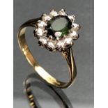 18ct yellow gold ring with large Oval faceted Peridot surrounded by twelve Diamonds (size 'Q' UK)