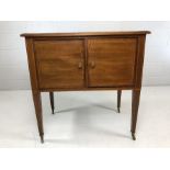 Mahogany two door music cabinet with inlay on castors