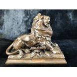 Bronzed lion inkwell with ornate pen holder with signature to base