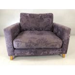 Contemporary upholstered love seat with purple butterfly design