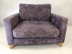 Contemporary upholstered love seat with purple butterfly design