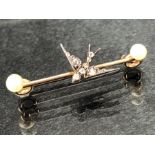 High Carat Gold brooch set with two Pearls and a central Gold Swallow set with Diamonds (total