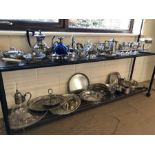 Large collection of silver plated items to include sugar shaker, trays etc. over two shelves