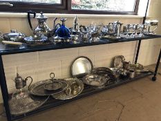 Large collection of silver plated items to include sugar shaker, trays etc. over two shelves