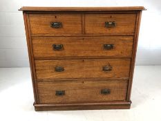 Mahogany chest of drawers, two over three, with copper handles