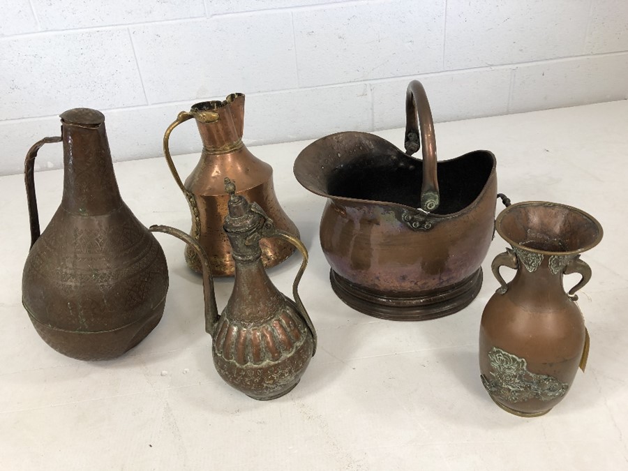 Collection of antique copper items to include ornate vase, coffee pot, Islamic water carrier etc.