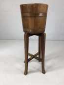 Wooden and brass-bound plant bucket on stand marked R A Lister