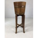 Wooden and brass-bound plant bucket on stand marked R A Lister