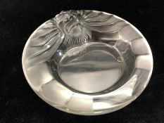 LALIQUE GLASS ASHTRAY with lions head to the border, signed 'Lalique France', approx 15cms diam