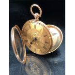 An 18ct gold keywind pocket watch by maker JTW London 1871 with engraved floral decoration, total